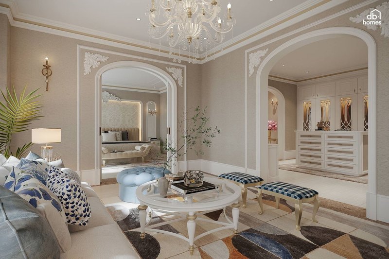 Bộ sofa mềm mại, bàn trà cổ điển và đèn chùm lấp lánh tạo nên sự sang trọng của phong cách thiết kế nội thất Tân Cổ Điển