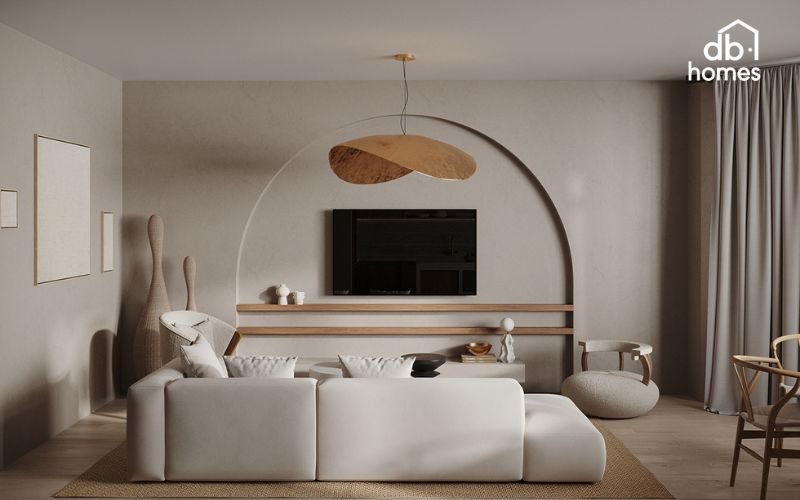 Phòng khách được bố trí mộc mạc, sử dụng gỗ tự nhiên kết hợp với tông màu trắng ngà trang nhã, tạo sự hài hòa và kết nối xuyên suốt không gian